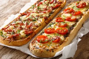 Baguettscheiben mit Tomaten & Mozzarella überbacken